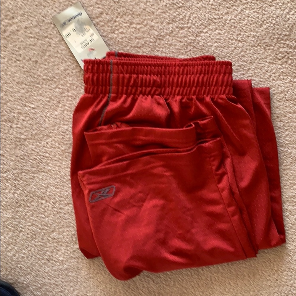 Men’s rust colored Reebok athletic pants